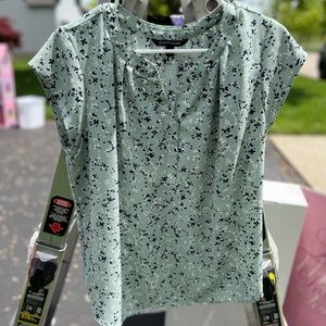 Women’s blouse, mossy green with small navy flowers.